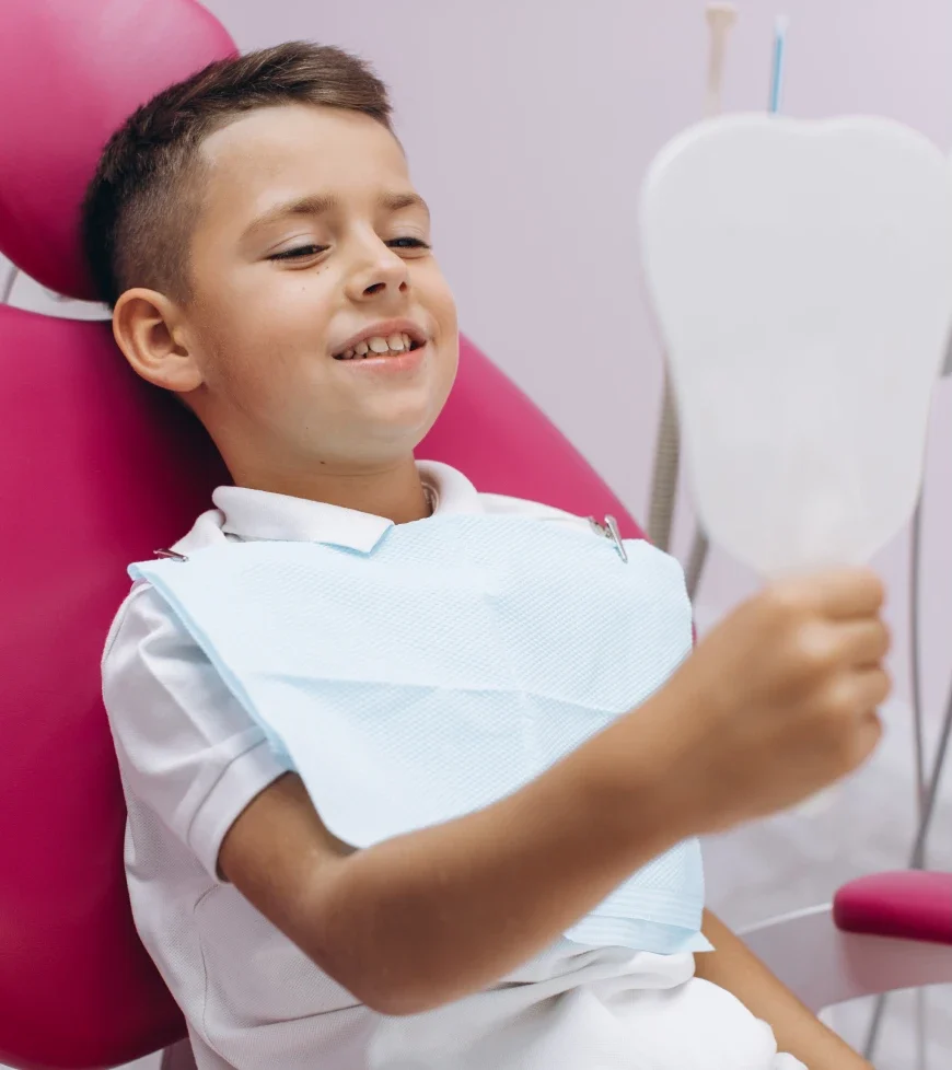 Young kid smiling at the dentist - Developmental Dentistry